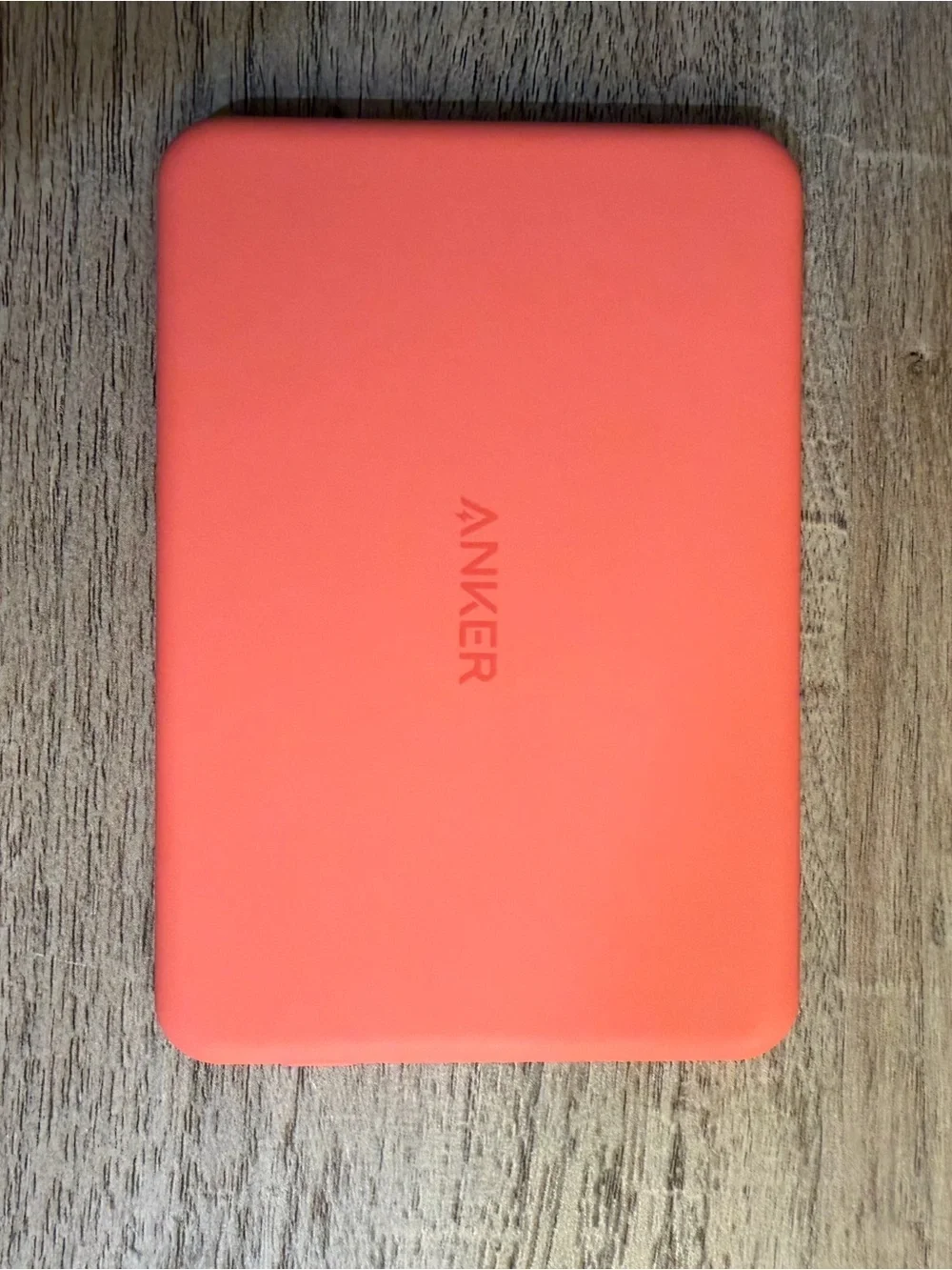 Anker Coral Orange Power Bank, Satechi Magnetic Wallet Stand, and Pop Socket